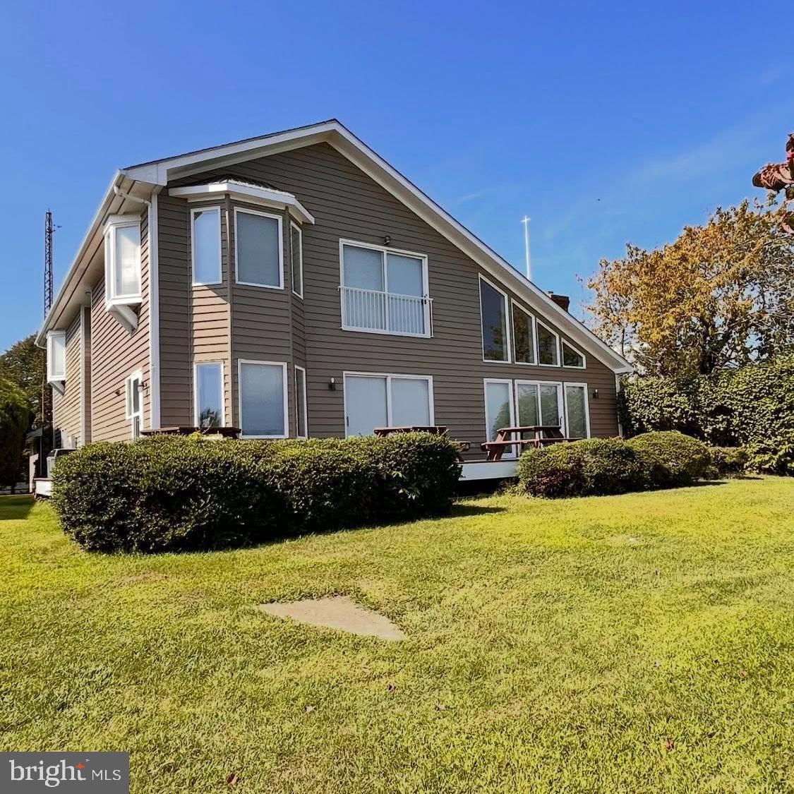235 Alexander La Solomons, MD 20688 - Photo 1 of 1 a front view of a house with a yard