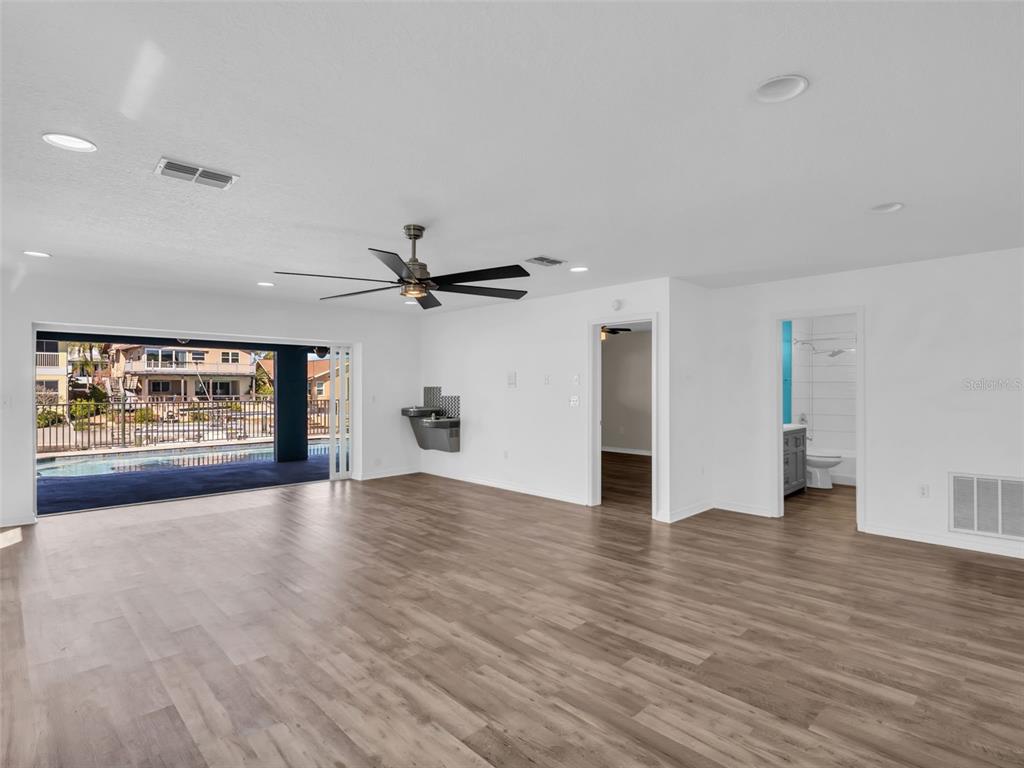 6241 Bayside Drive New Port Richey, FL 34652 - Photo 36 of 78 a view of empty room with wooden floor and fan