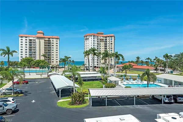 a roof deck with table and chairs