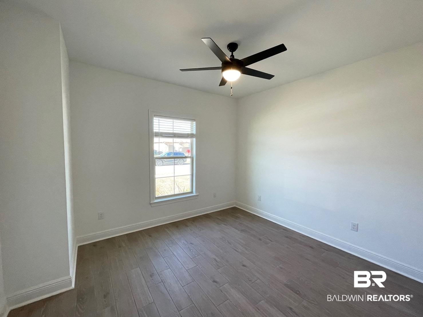 1396 Fenton Circle Foley, AL 36535 - Photo 9 of 14 Spare room with ceiling fan and dark wood-type flooring