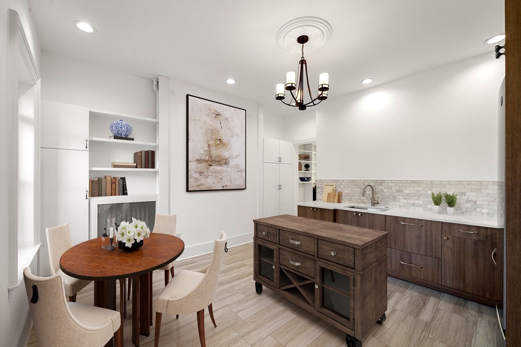 548 Massachusetts Avenue, Unit 3 Boston, MA 02118 - Photo 2 of 28 a view of a room with furniture and wooden floor