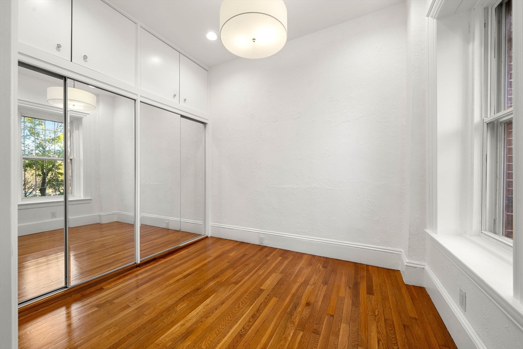 548 Massachusetts Avenue, Unit 3 Boston, MA 02118 - Photo 23 of 28 a view of empty room with wooden floor