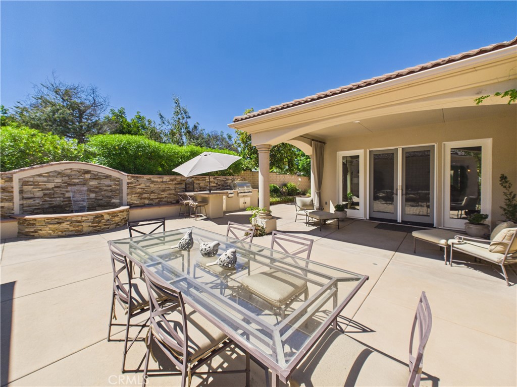 1662 Cherokee Road Corona, CA 92881 - Photo 47 of 60 a view of a patio with couches table and chairs and potted plants
