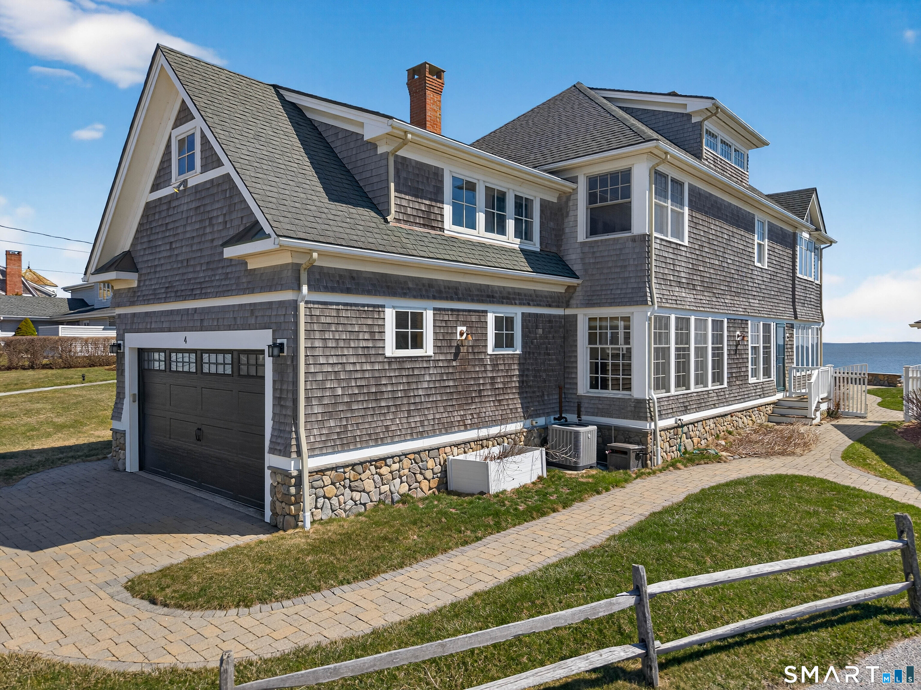 4 Point Road Old Saybrook, CT 06475 - Photo 1 of 1 a front view of a house with a yard