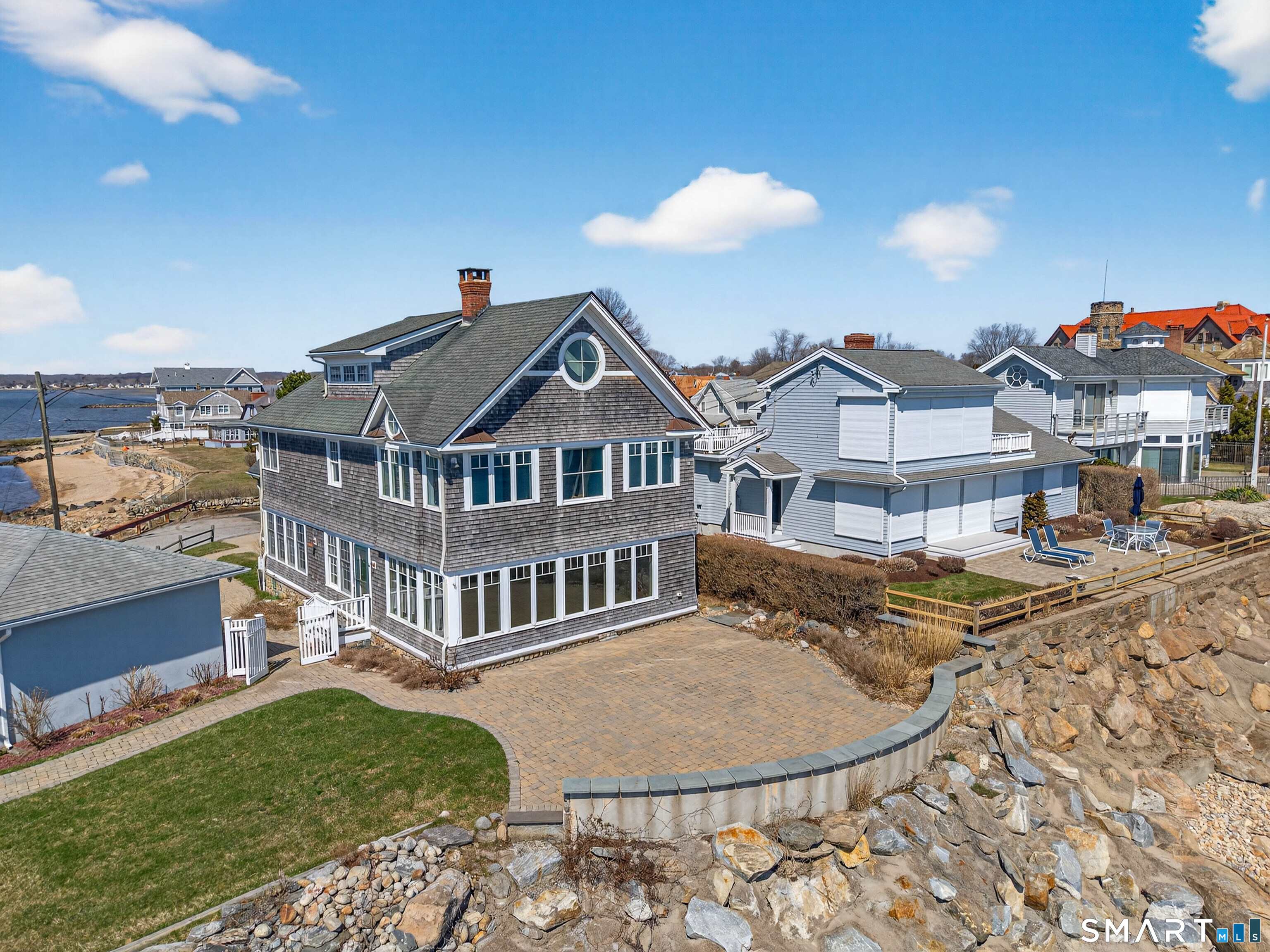 4 Point Road Old Saybrook, CT 06475 - Photo 12 of 58 a front view of a house with a yard