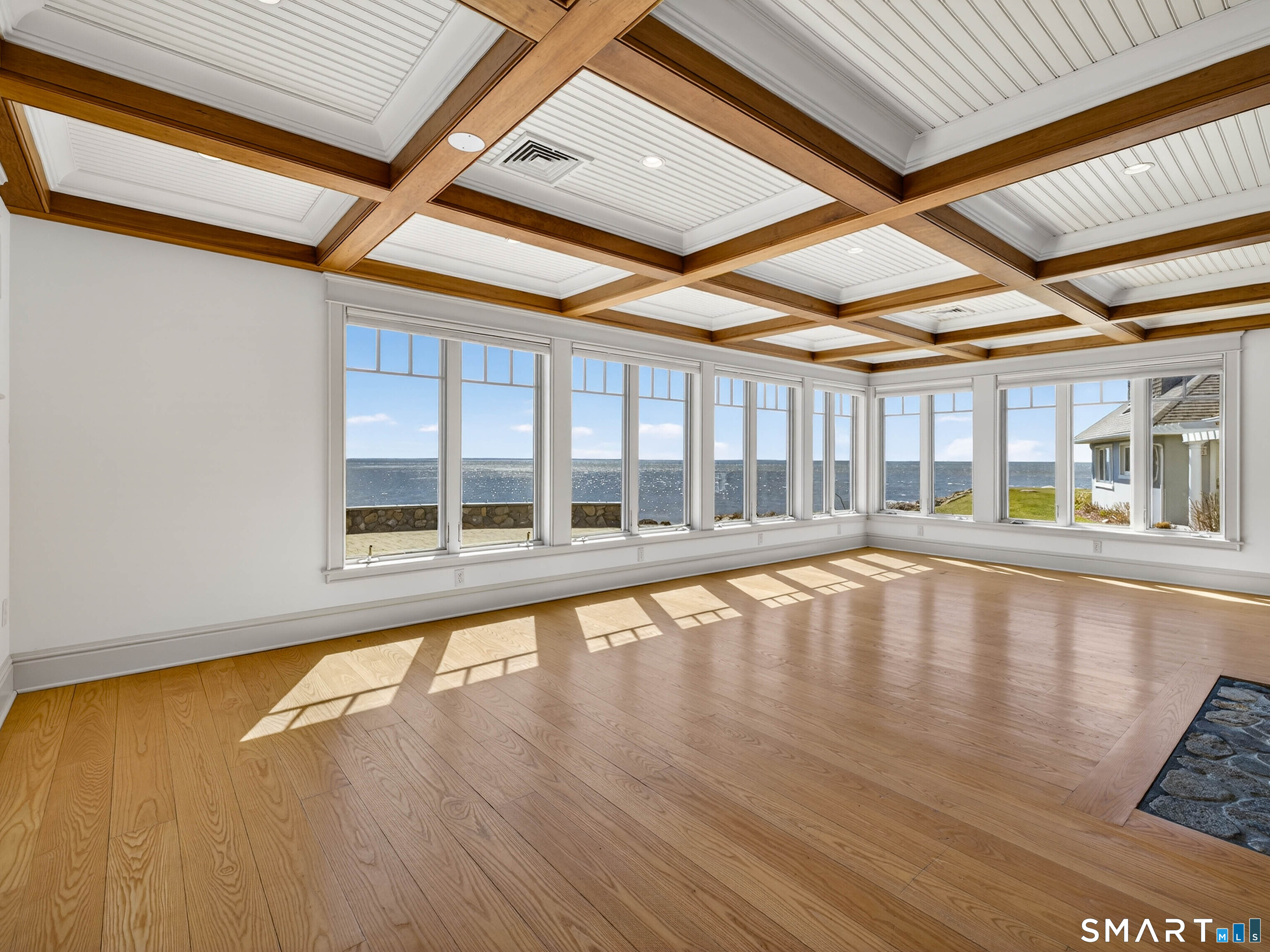 4 Point Road Old Saybrook, CT 06475 - Photo 20 of 58 a view of empty room with wooden floor and fan