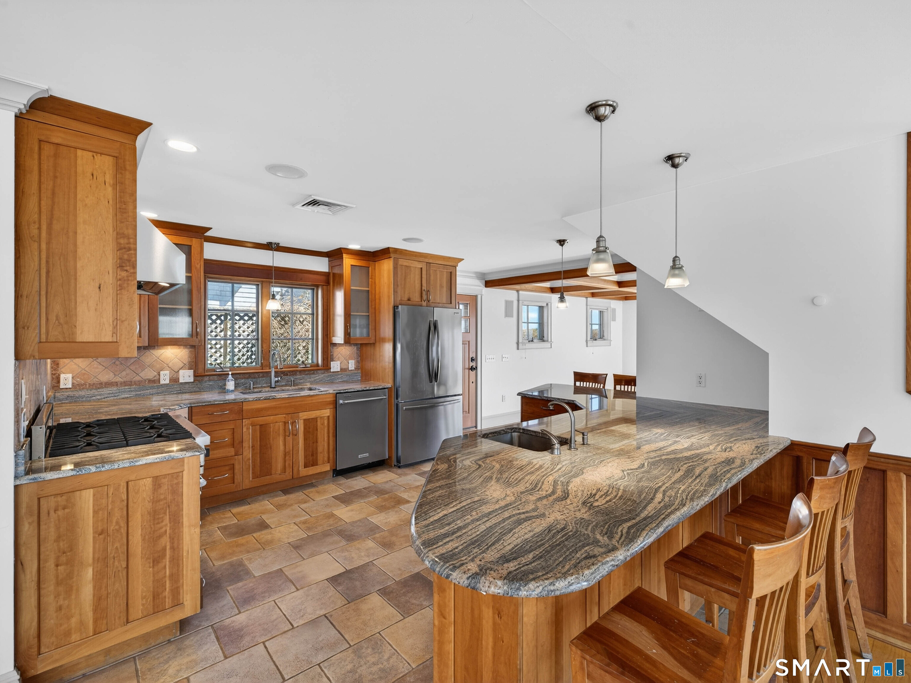 4 Point Road Old Saybrook, CT 06475 - Photo 24 of 58 a kitchen with stainless steel appliances granite countertop a stove a sink and a refrigerator