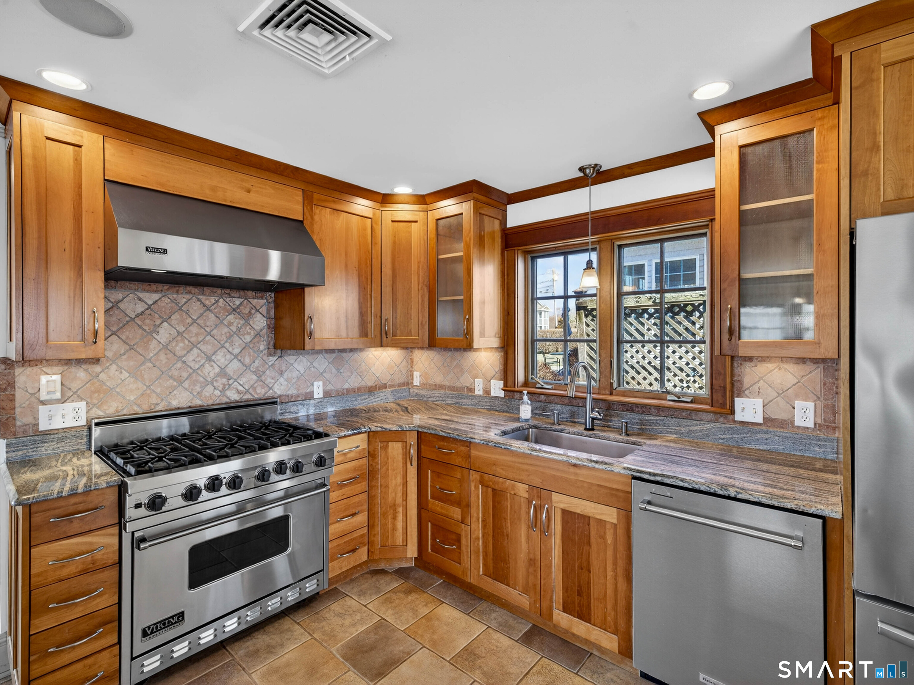 4 Point Road Old Saybrook, CT 06475 - Photo 26 of 58 a kitchen with stainless steel appliances granite countertop a stove and a sink