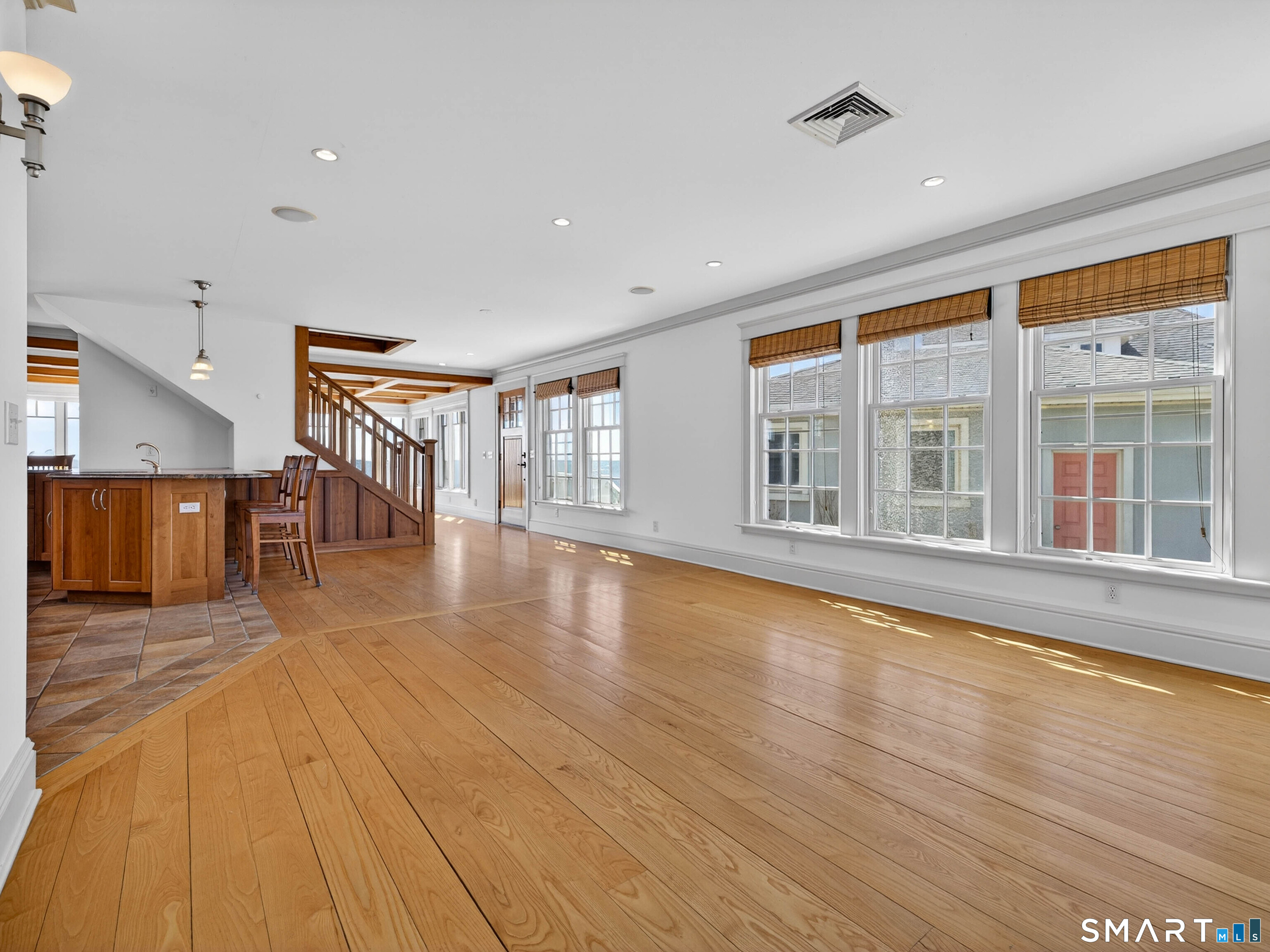 4 Point Road Old Saybrook, CT 06475 - Photo 30 of 58 a view of an empty room with wooden floor and a window