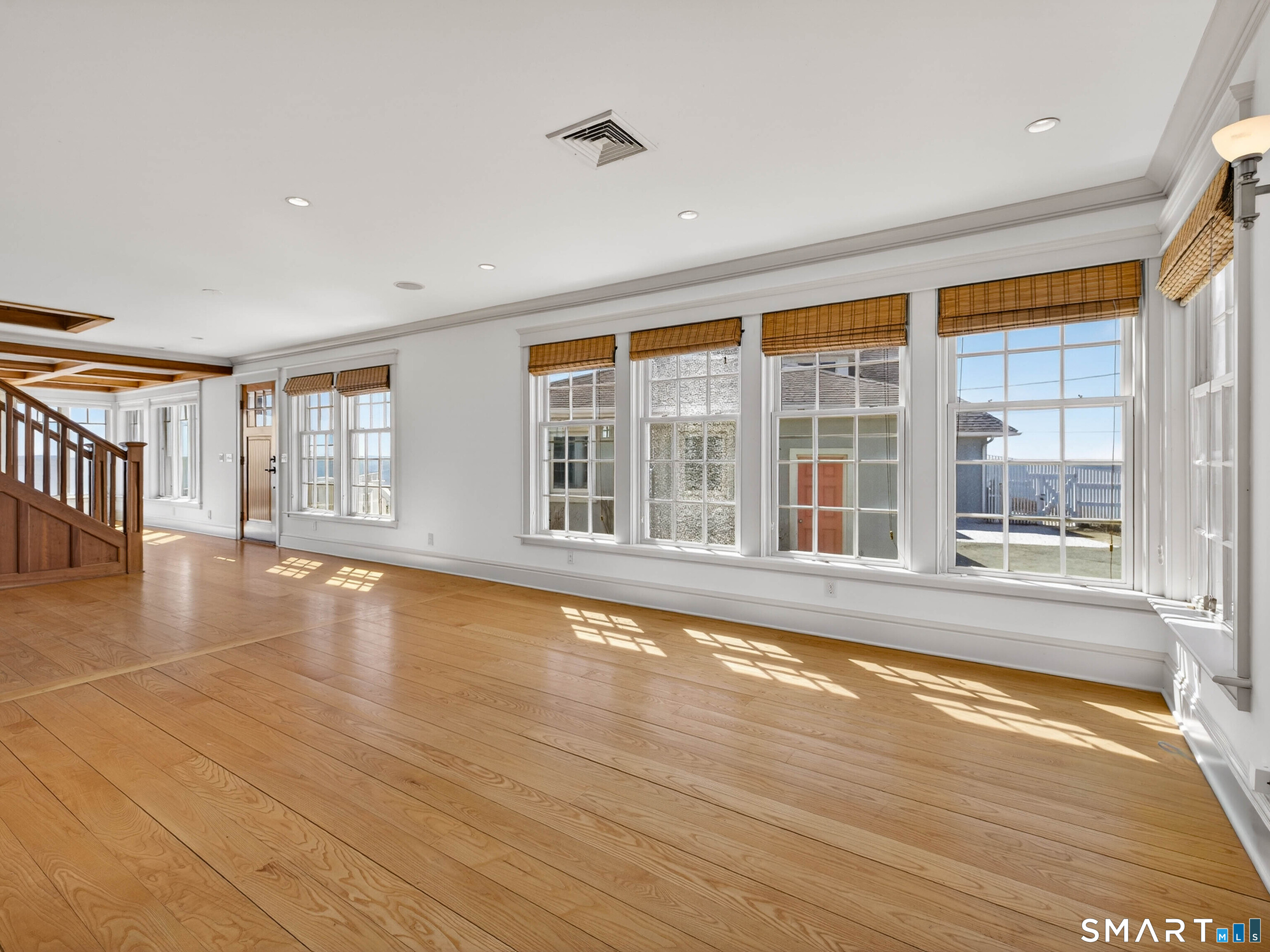 4 Point Road Old Saybrook, CT 06475 - Photo 32 of 58 a view of an empty room with wooden floor and a window