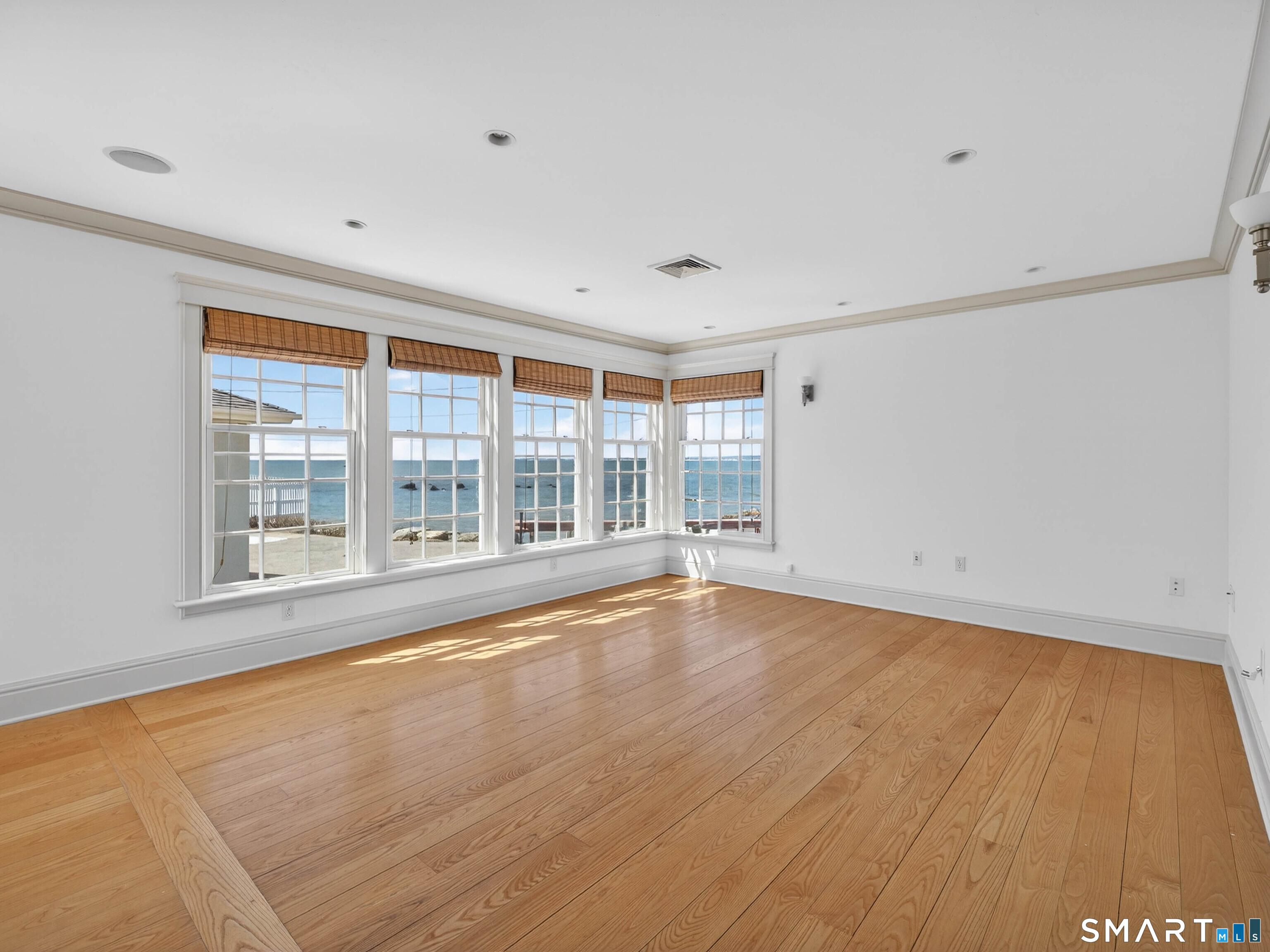 4 Point Road Old Saybrook, CT 06475 - Photo 34 of 58 a view of an empty room with a window and wooden floor