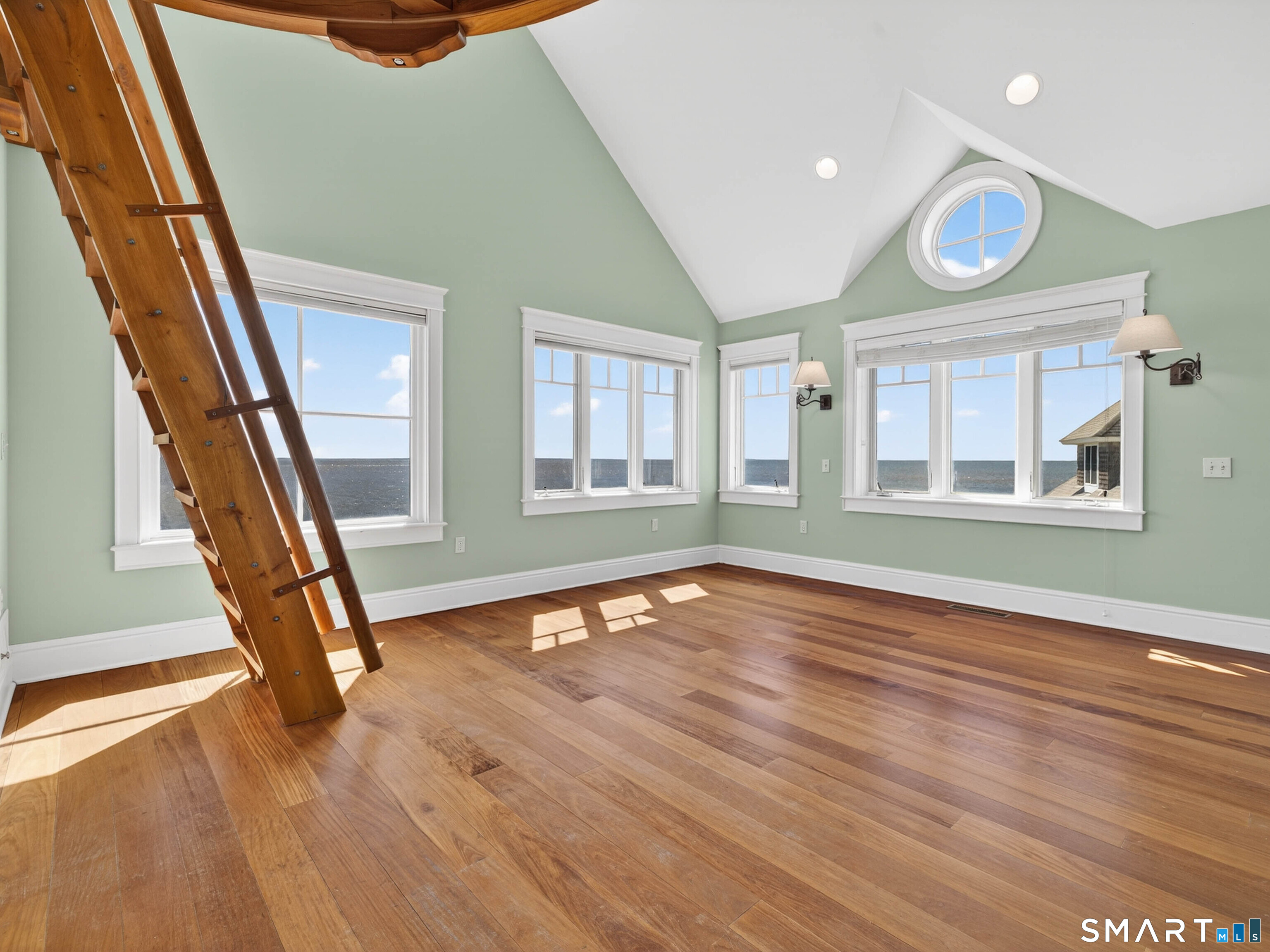 4 Point Road Old Saybrook, CT 06475 - Photo 36 of 58 a view of an empty room with wooden floor and stairs