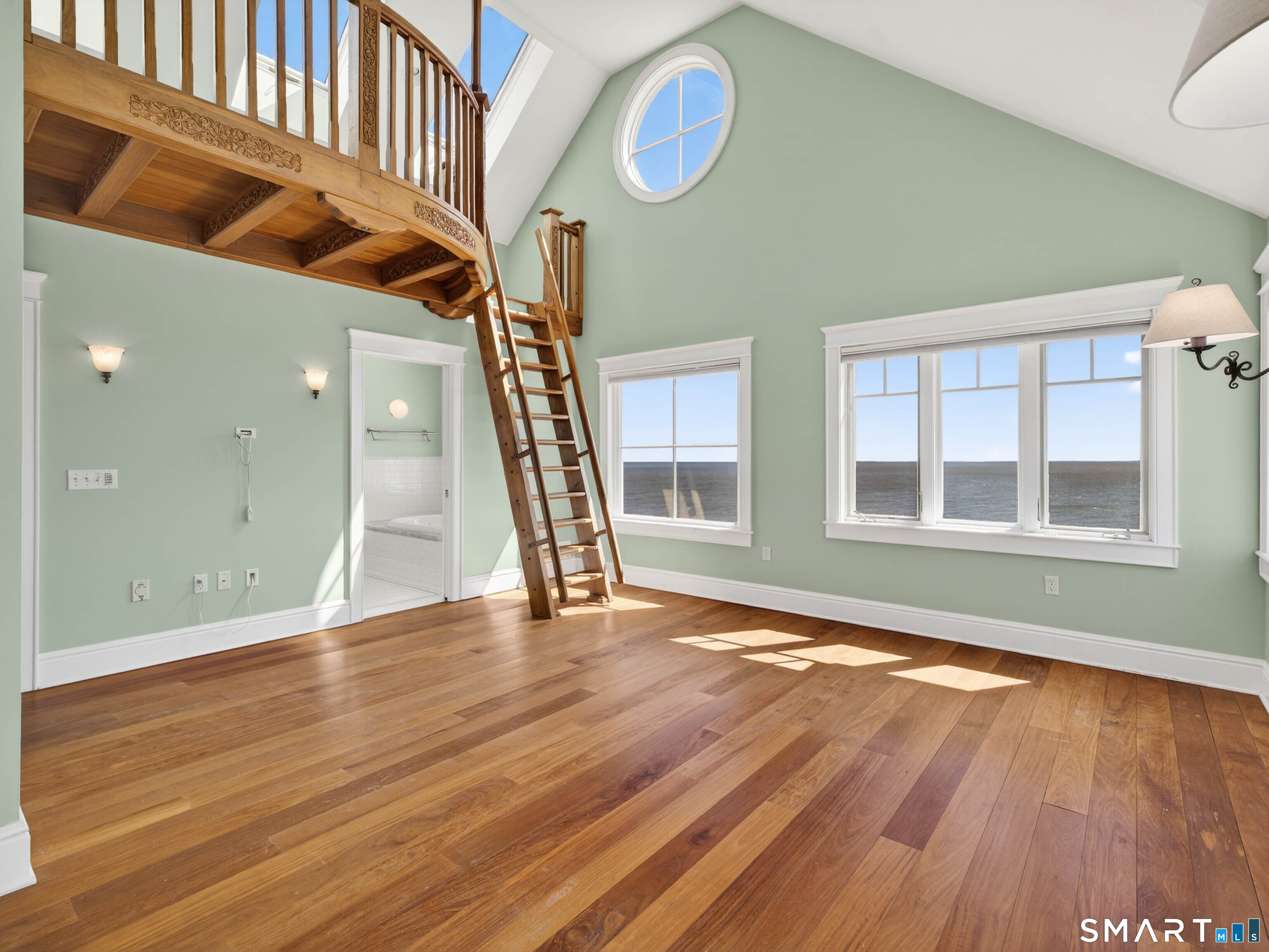 4 Point Road Old Saybrook, CT 06475 - Photo 38 of 58 a view of an empty room with wooden floor and a window