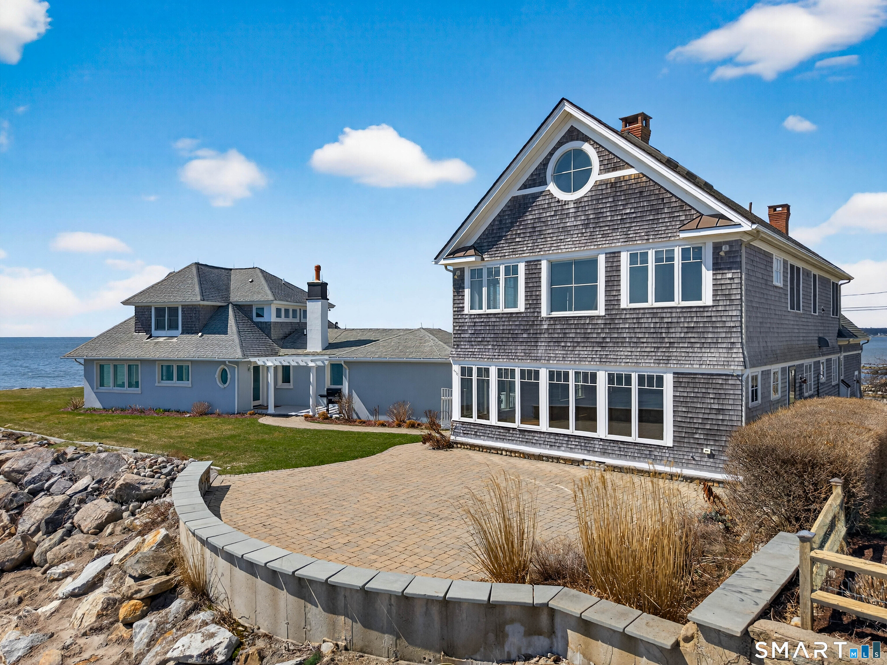 4 Point Road Old Saybrook, CT 06475 - Photo 4 of 58 a front view of a house with a yard and balcony