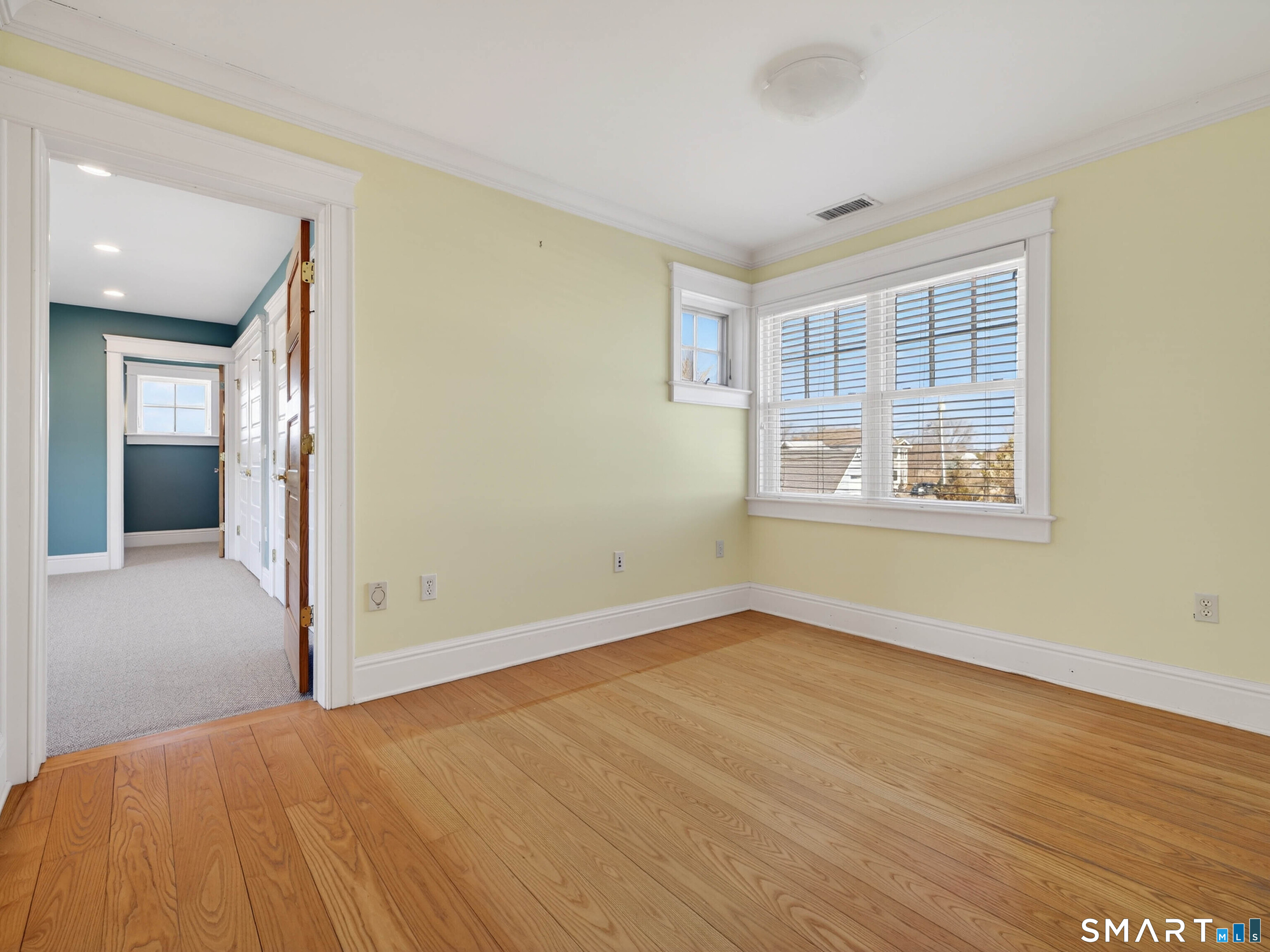 4 Point Road Old Saybrook, CT 06475 - Photo 46 of 58 a view of an empty room with wooden floor