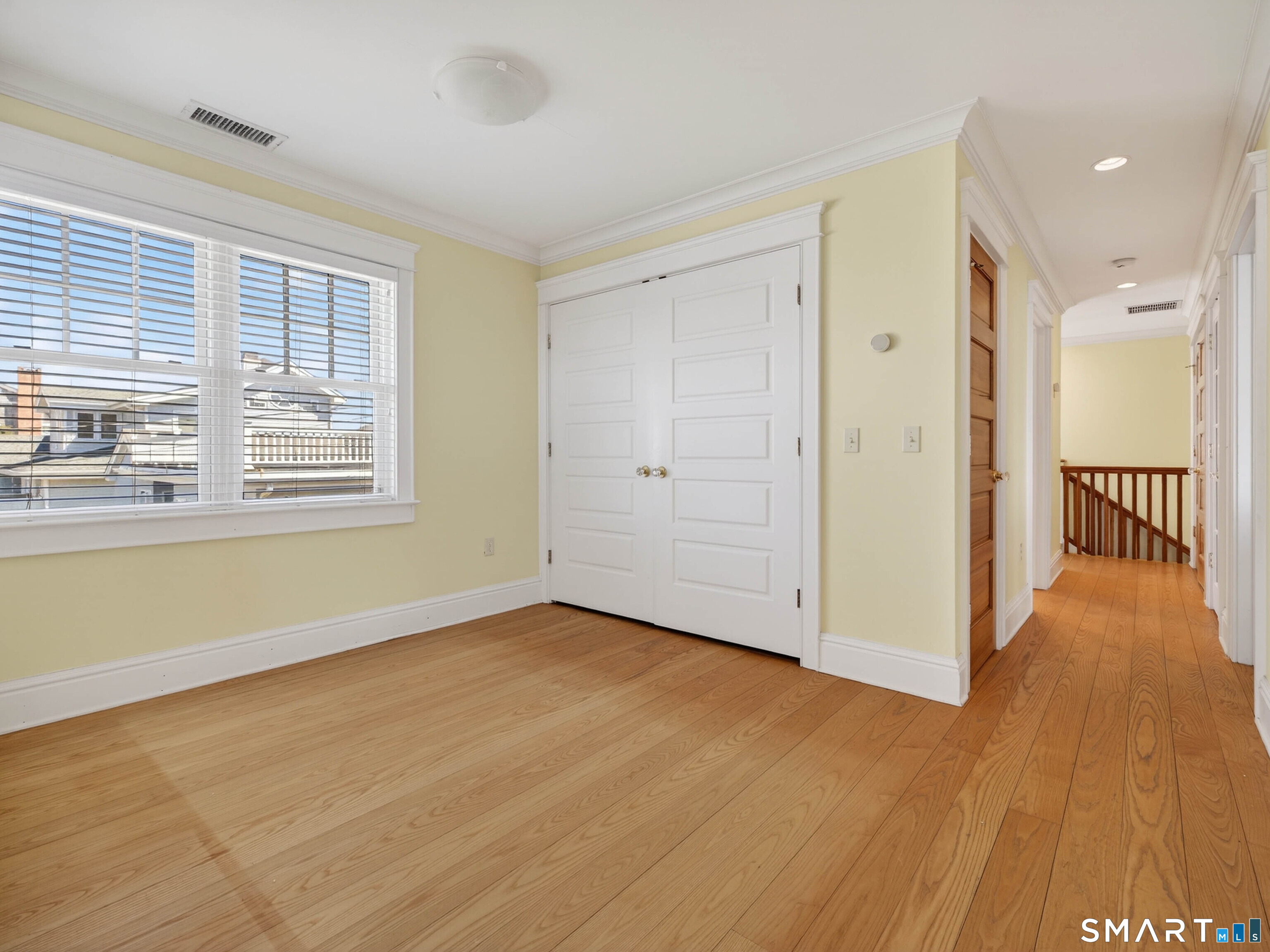4 Point Road Old Saybrook, CT 06475 - Photo 48 of 58 a view of an empty room with wooden floor and a window