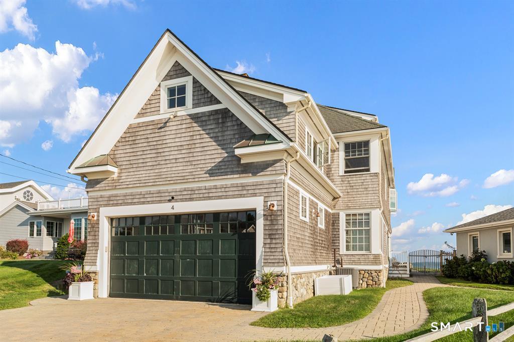 4 Point Road Old Saybrook, CT 06475 - Photo 51 of 58 a front view of a house with a yard
