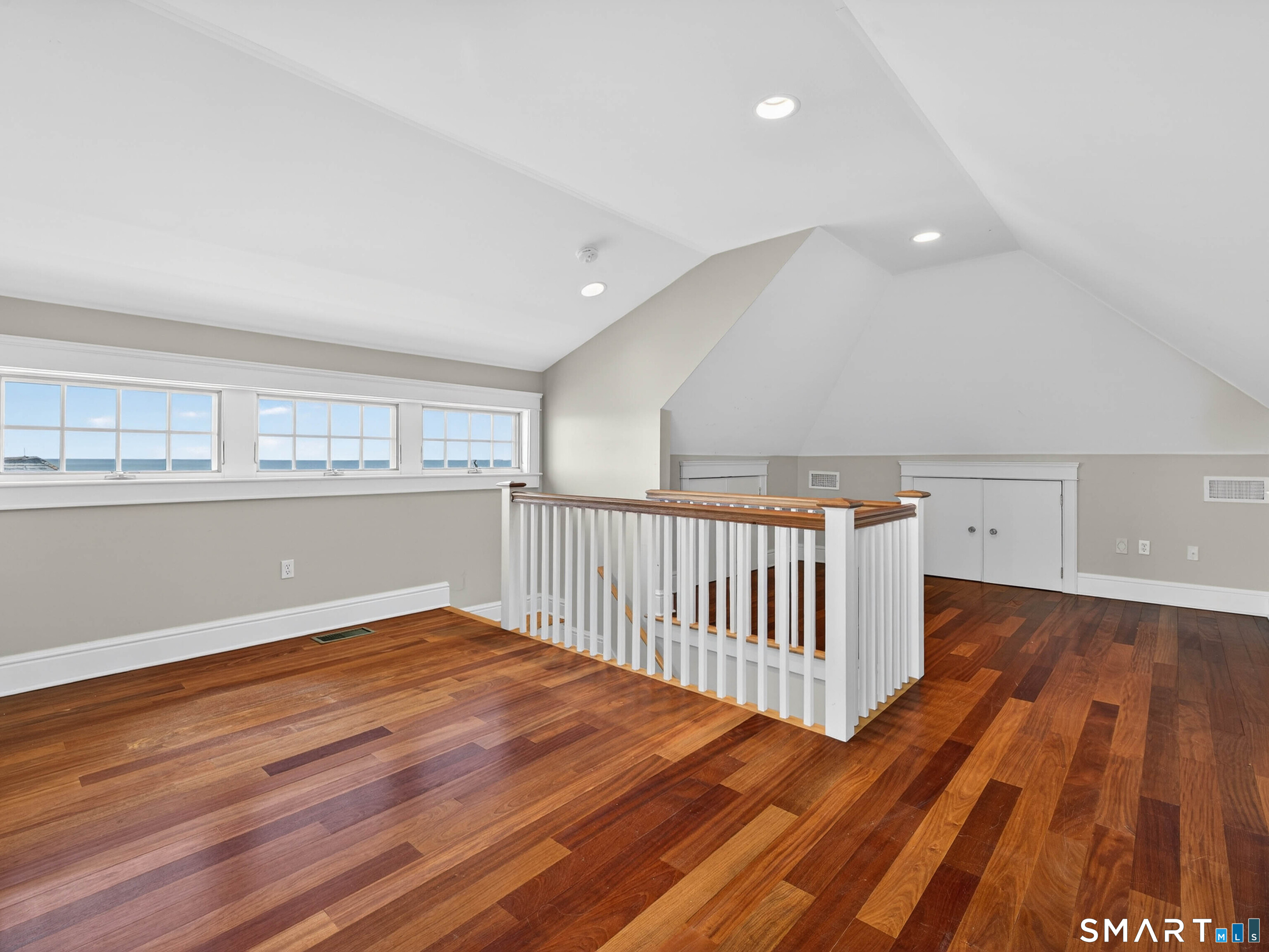 4 Point Road Old Saybrook, CT 06475 - Photo 54 of 58 a view of an empty room with wooden floor and a window