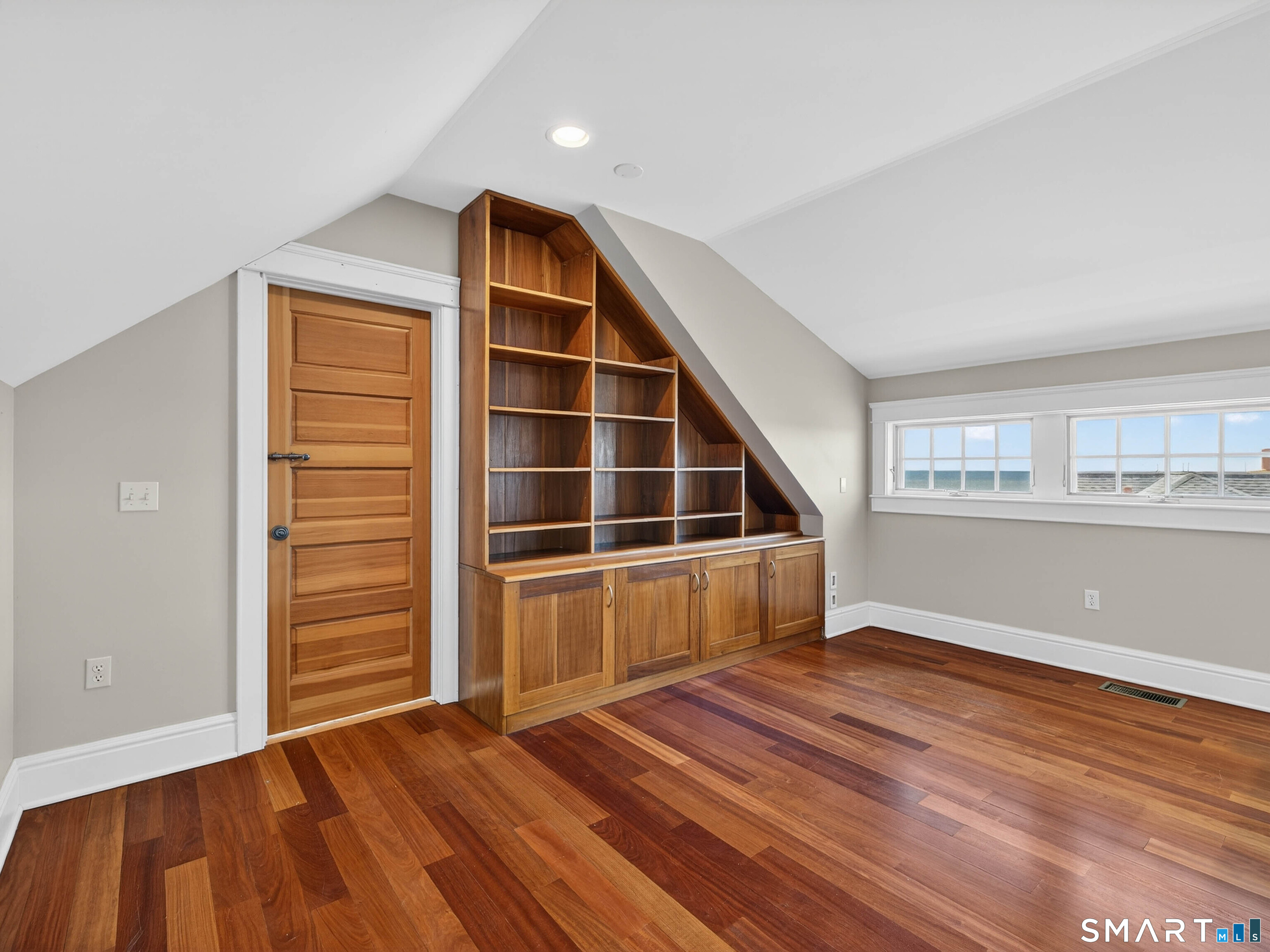 4 Point Road Old Saybrook, CT 06475 - Photo 55 of 58 a view of an empty room with wooden floor and a window