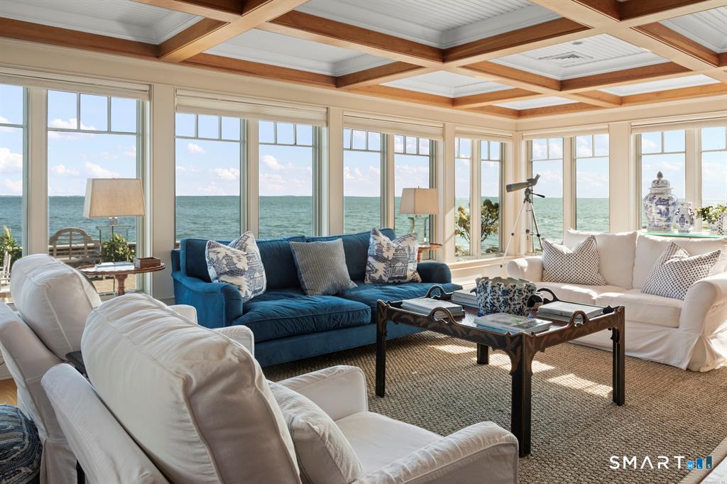 4 Point Road Old Saybrook, CT 06475 - Photo 7 of 58 a living room with furniture large windows and wooden floor