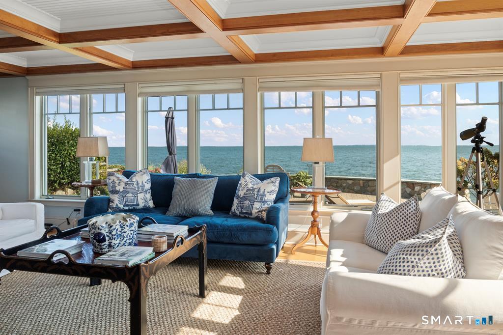 4 Point Road Old Saybrook, CT 06475 - Photo 9 of 58 a living room with furniture and a large window