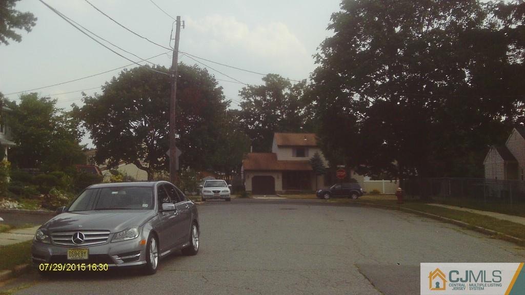 23 Wilshire Road Edison, NJ 08817 - Photo 18 of 21 a car parked in front of a house