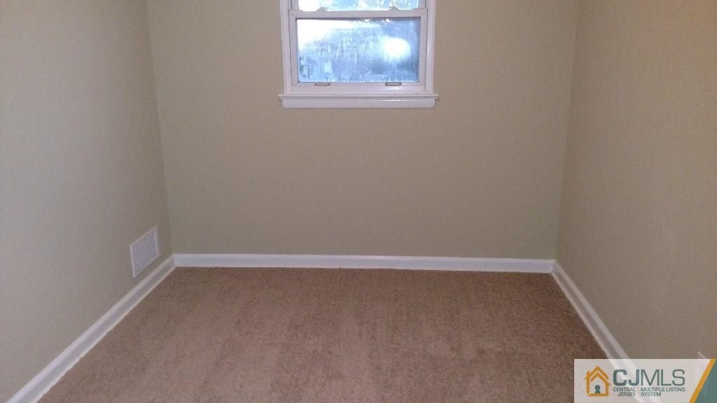 23 Wilshire Road Edison, NJ 08817 - Photo 19 of 21 an empty room with a window