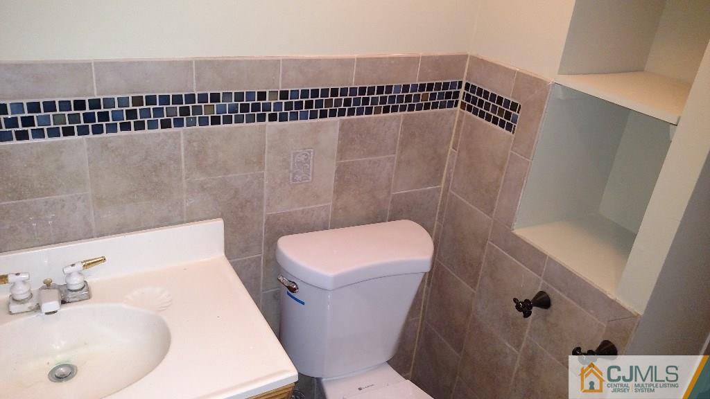 23 Wilshire Road Edison, NJ 08817 - Photo 9 of 21 a bathroom with a sink and a toilet