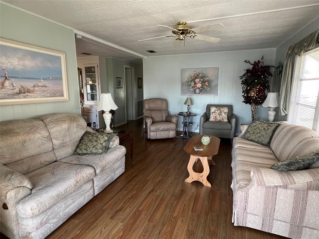 263 Sago Palm Street Largo, FL 33778 - Photo 13 of 29 a living room with furniture and wooden floor