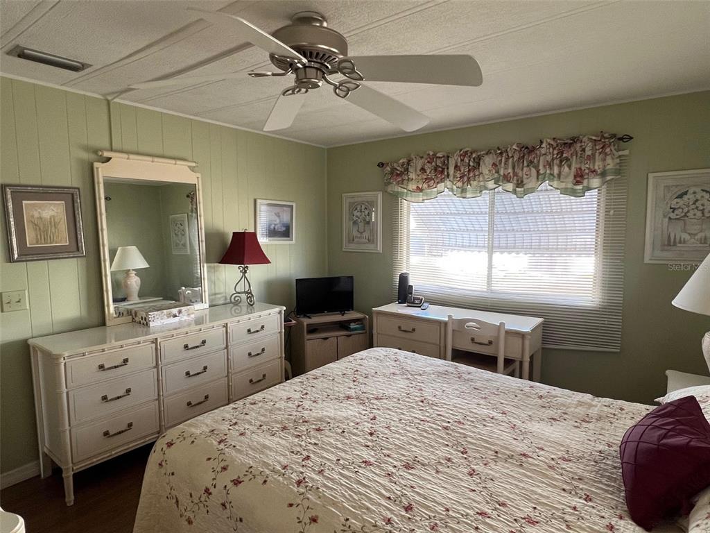263 Sago Palm Street Largo, FL 33778 - Photo 26 of 29 a bedroom with a bed and a window