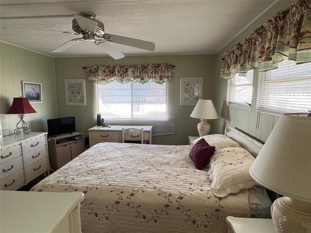 263 Sago Palm Street Largo, FL 33778 - Photo 27 of 29 a bedroom with a large bed and a window