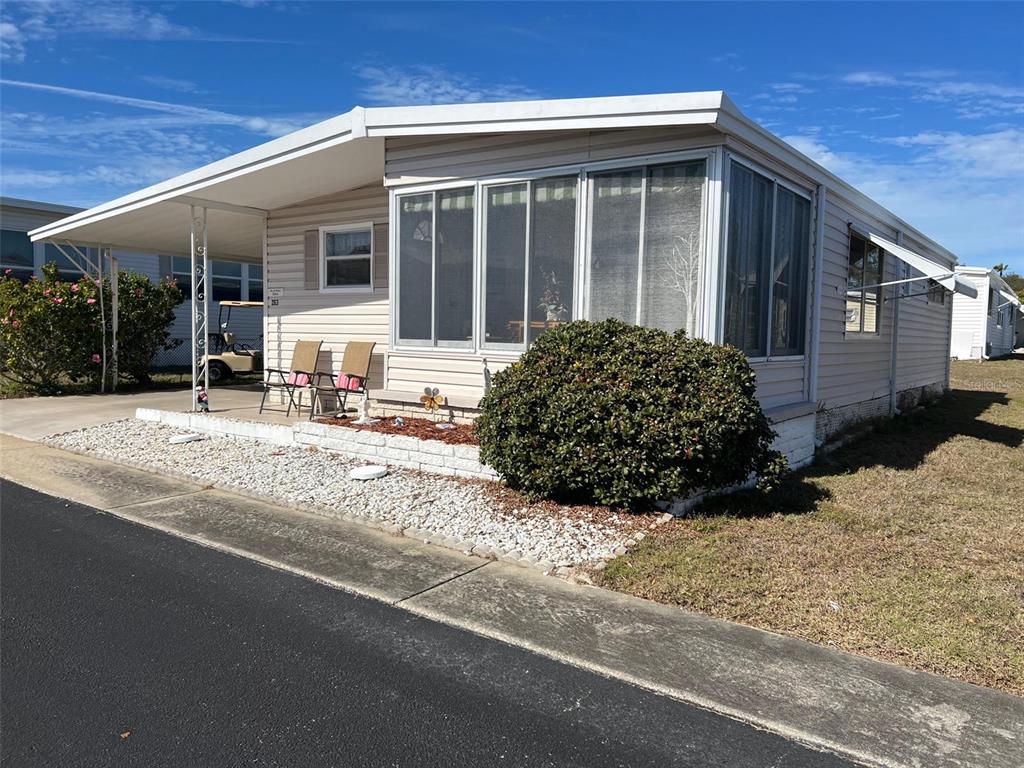 263 Sago Palm Street Largo, FL 33778 - Photo 3 of 29 a view of a house with a outdoor space