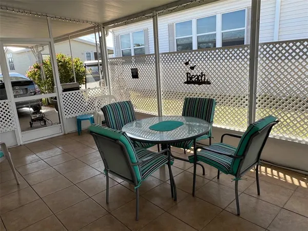 a view of a chairs and table in the patio