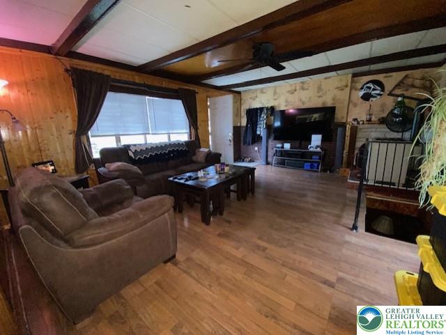 2236 Hillside Road Slatington, PA 18080 - Photo 3 of 13 a living room with furniture a fireplace and a flat screen tv