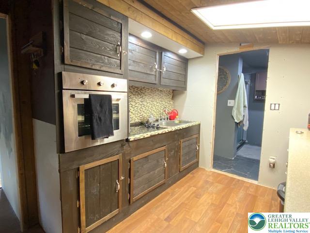 2236 Hillside Road Slatington, PA 18080 - Photo 5 of 13 a kitchen with stainless steel appliances kitchen island granite countertop a refrigerator and a stove