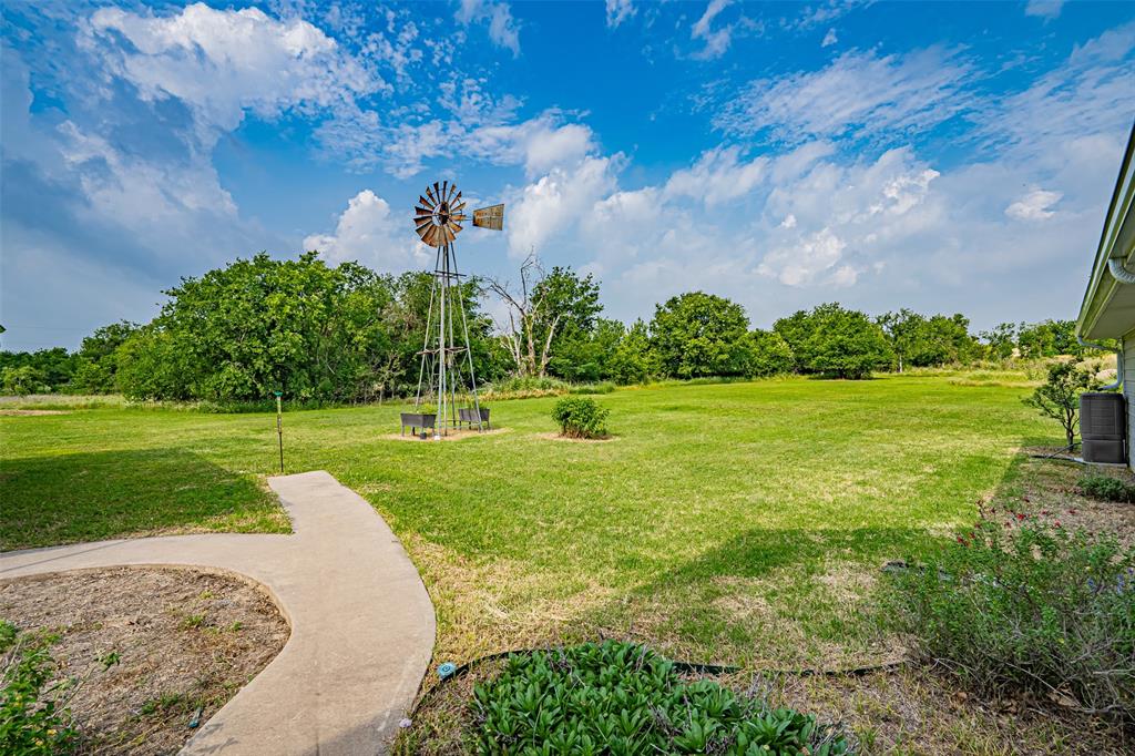 501 Endora Dublin, TX 76446 - Photo 38 of 39 a view of a garden with a building in the background
