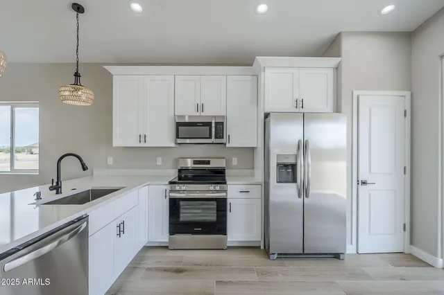 a workspace with furniture and a potted plant