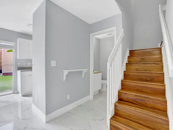 a view of entryway with wooden floor