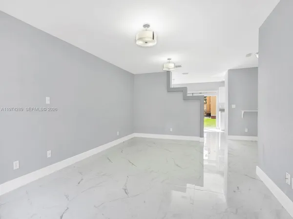 a view of a hallway with a chandelier