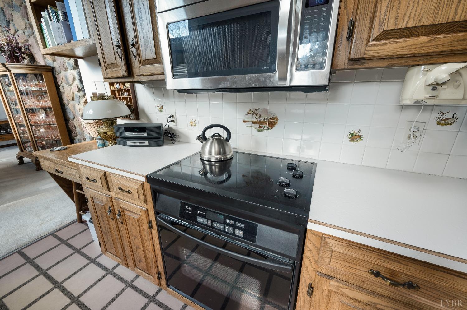 7903 Charlemont Road Goode, VA 24556 - Photo 15 of 47 a kitchen with a stove and a microwave