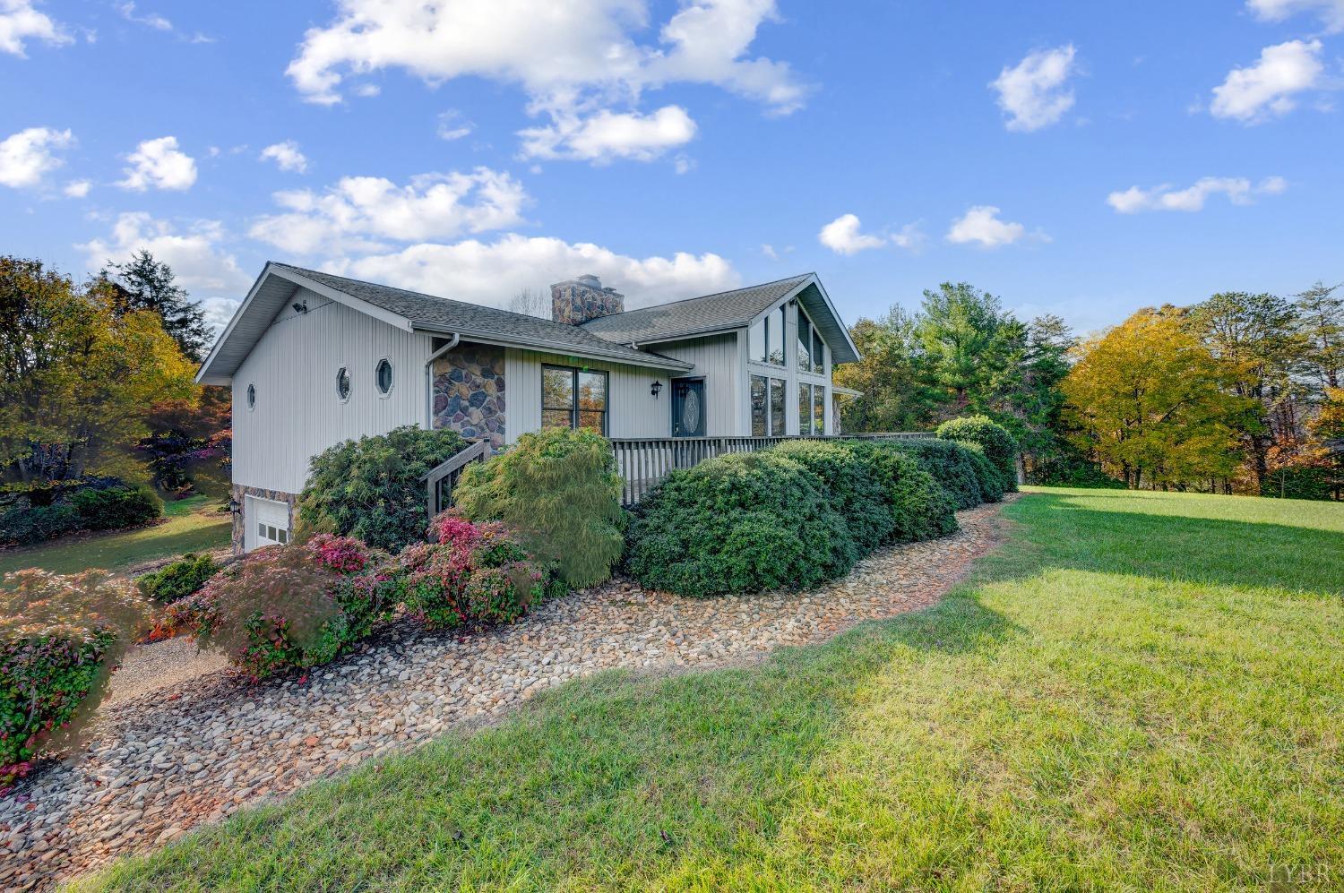 7903 Charlemont Road Goode, VA 24556 - Photo 2 of 47 a front view of house with yard and green space