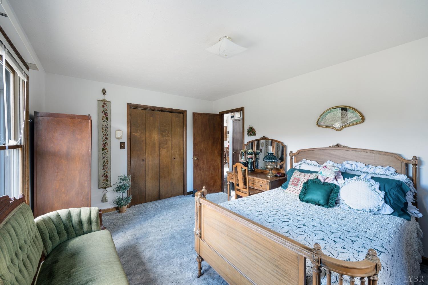 7903 Charlemont Road Goode, VA 24556 - Photo 22 of 47 a living room with furniture and a table