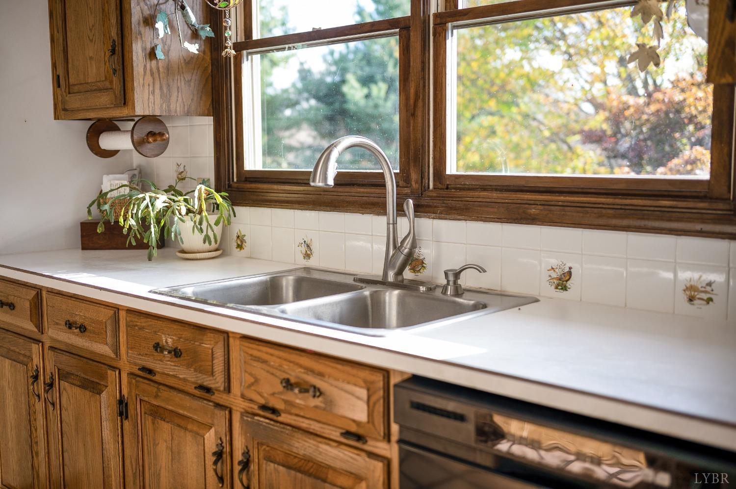 7903 Charlemont Road Goode, VA 24556 - Photo 28 of 47 a kitchen with a sink and a large window