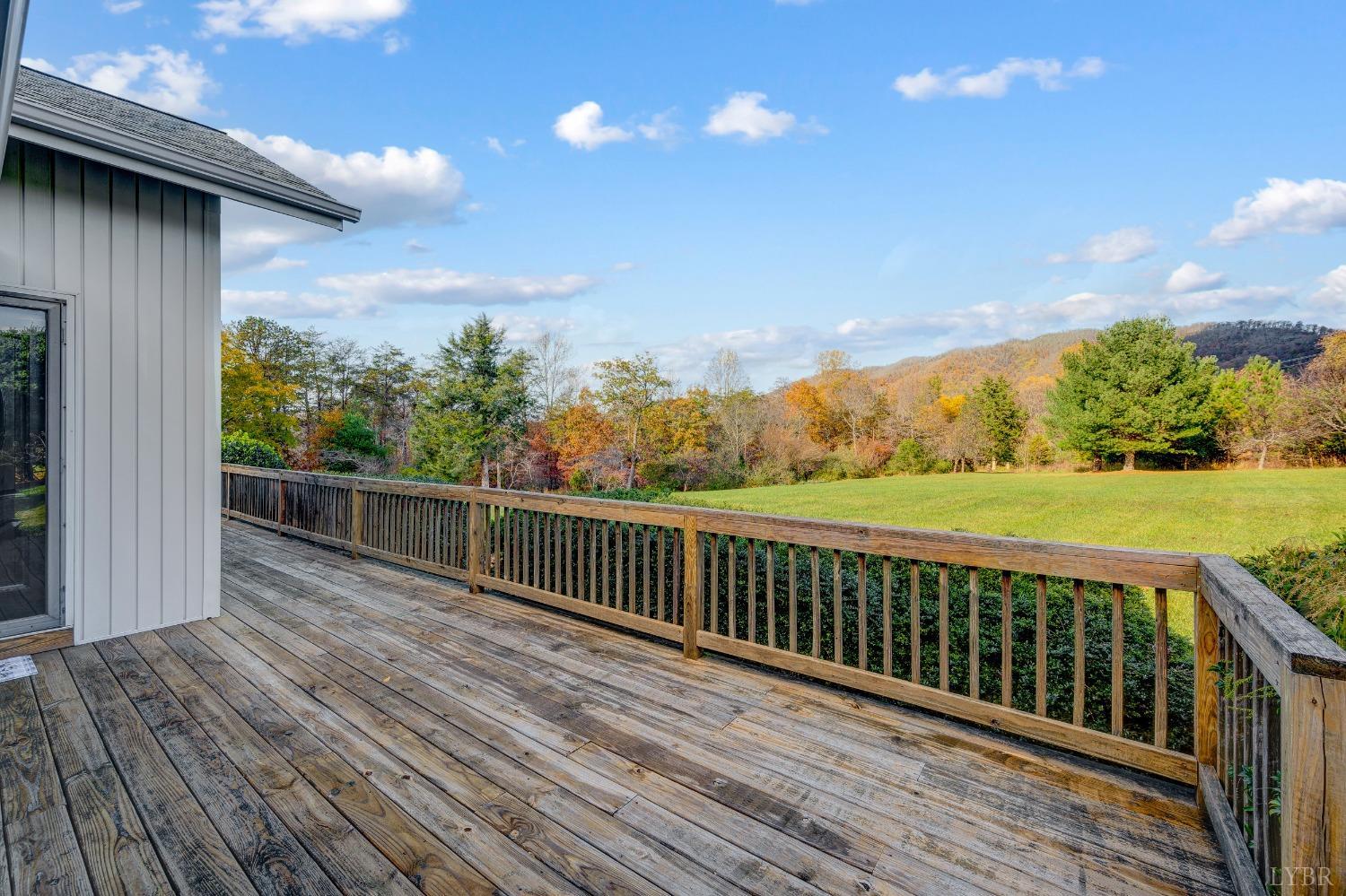 7903 Charlemont Road Goode, VA 24556 - Photo 31 of 47 a balcony with wooden floor and fence