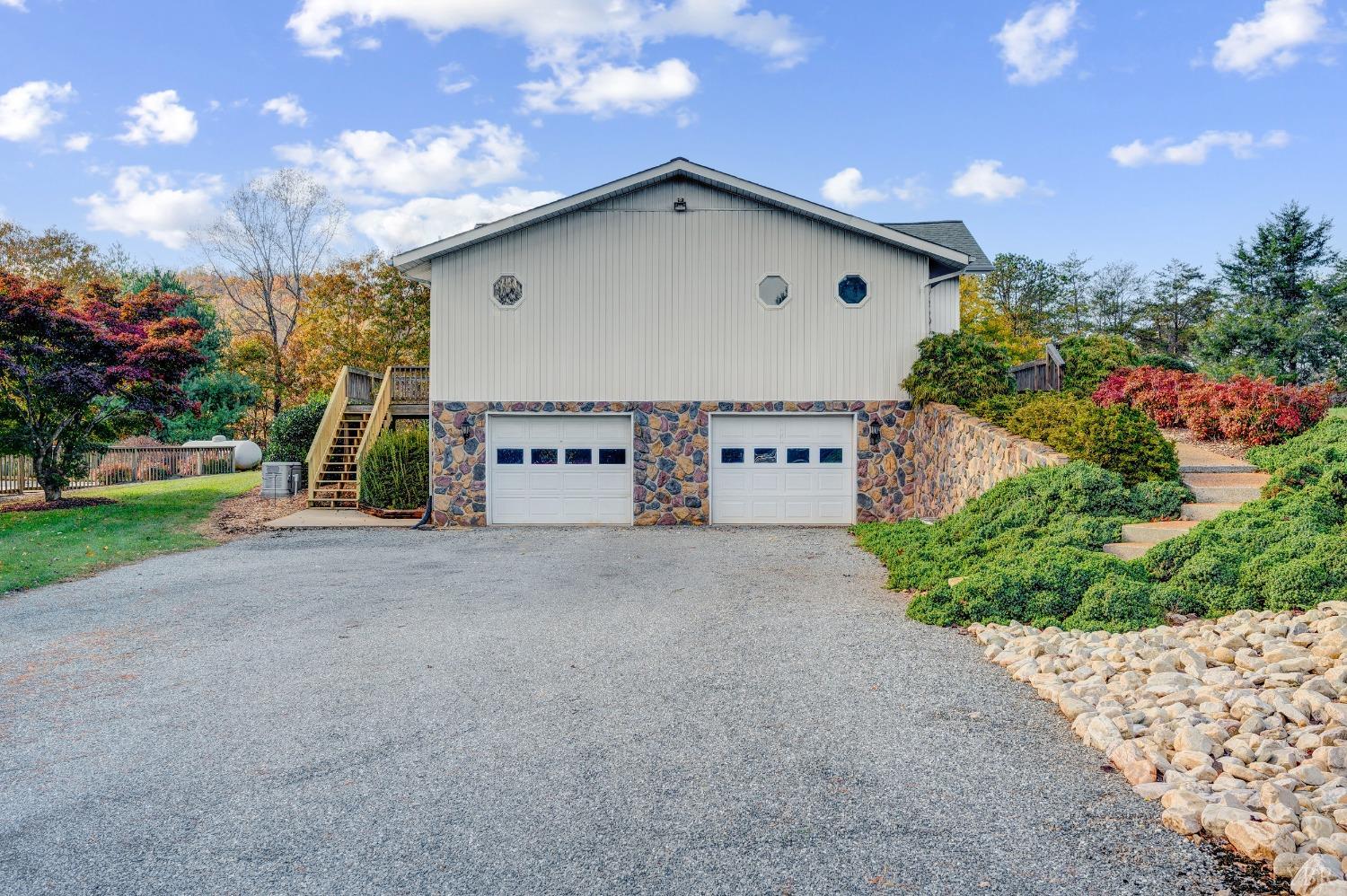 7903 Charlemont Road Goode, VA 24556 - Photo 34 of 47 a view of a house with a yard and garage