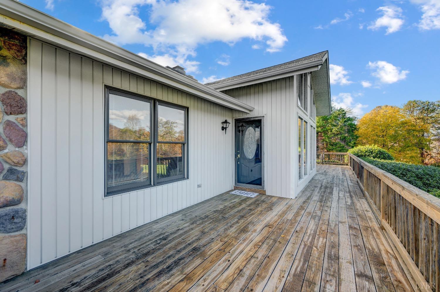 7903 Charlemont Road Goode, VA 24556 - Photo 4 of 47 a view of backyard with a large tree and wooden floor