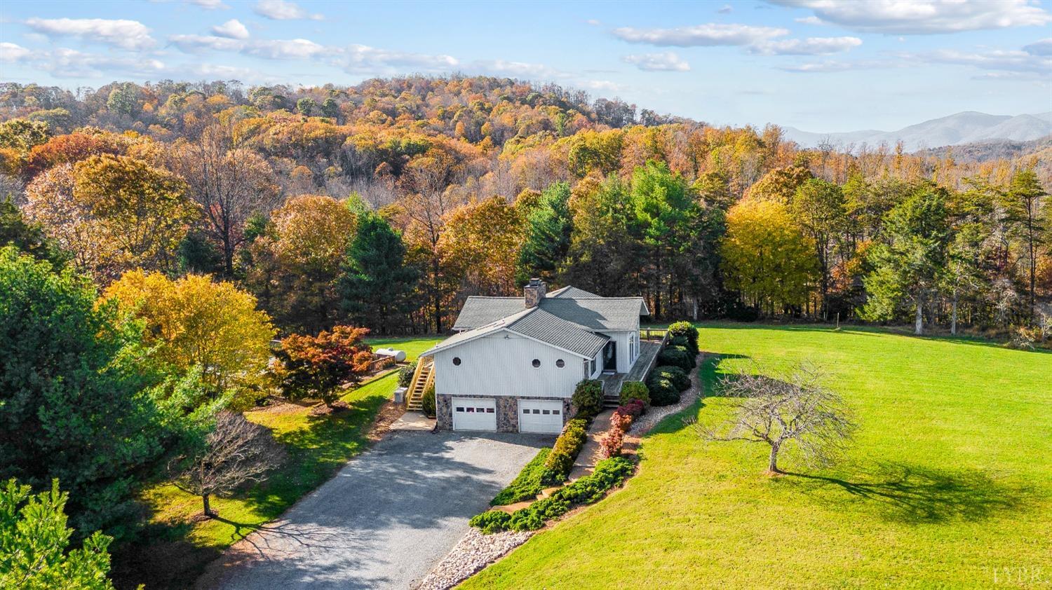 7903 Charlemont Road Goode, VA 24556 - Photo 42 of 47 a view of a house with a yard