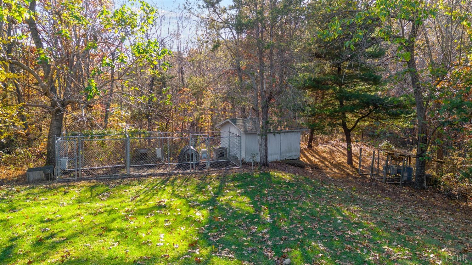 7903 Charlemont Road Goode, VA 24556 - Photo 45 of 47 a backyard of a house with lots of green space and fountain