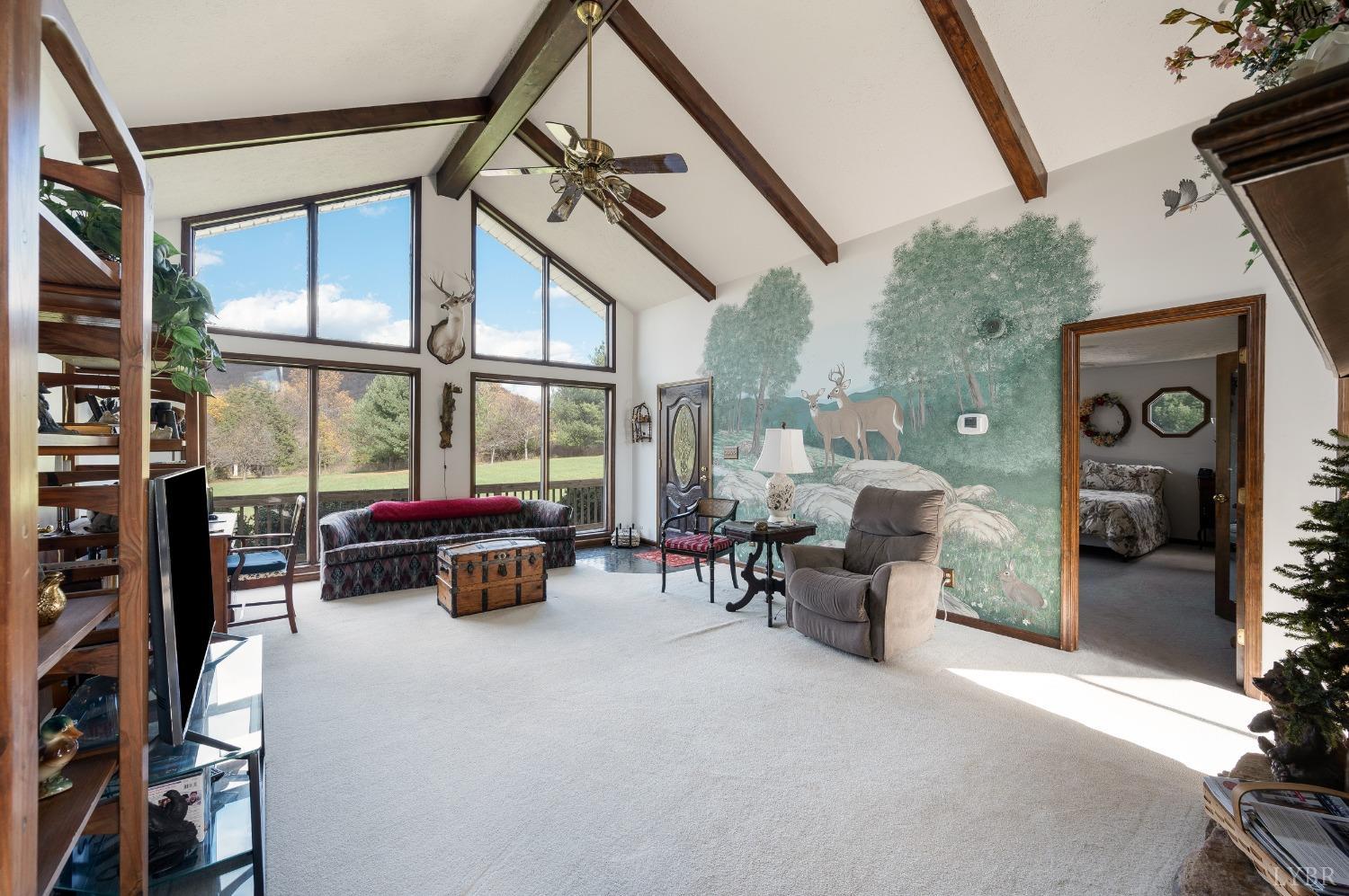7903 Charlemont Road Goode, VA 24556 - Photo 7 of 47 a living room with furniture and a window
