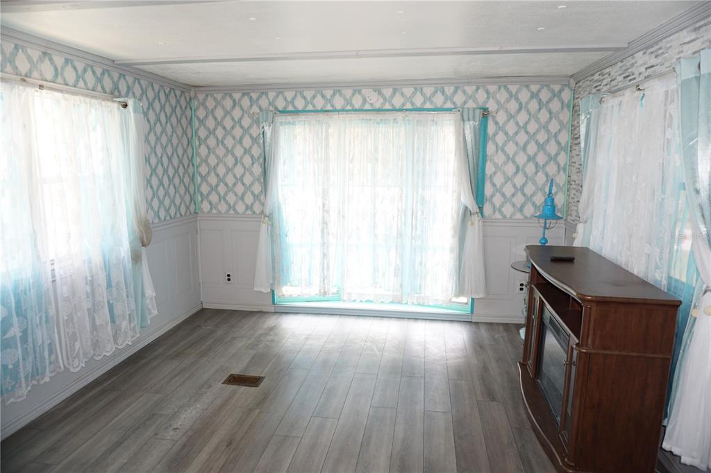 15371 Mango Drive Punta Gorda, FL 33955 - Photo 11 of 62 a view of a room with wooden floor and a window